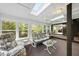 Comfortable sunroom with skylights and plenty of windows with wooded views at 13 Crosswinds Estates Dr, Pittsboro, NC 27312