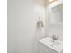 Bright bathroom featuring a modern vanity, neutral paint, and decorative mirror at 13 Pegram Ct, Durham, NC 27703