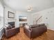 Open-concept living room with hardwood floors, a fireplace, and lots of light at 13 Pegram Ct, Durham, NC 27703
