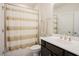 Bathroom featuring a shower with a patterned curtain, a toilet, and a vanity at 134 Cotten Dr, Morrisville, NC 27560