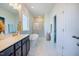 Bright bathroom featuring a soaking tub, walk-in shower, and double sink vanity at 134 Cotten Dr, Morrisville, NC 27560