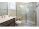 Contemporary bathroom featuring a glass enclosed shower with bench seating, plus ample vanity counter space at 134 Cotten Dr, Morrisville, NC 27560