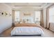 A cozy bedroom featuring a comfortable queen size bed and two bedside tables at 134 Cotten Dr, Morrisville, NC 27560