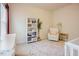 Comfortable Bedroom featuring a bookshelf, rocking chair, and crib at 134 Cotten Dr, Morrisville, NC 27560