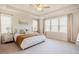 A cozy bedroom featuring a comfortable queen size bed, tray ceilings, and lots of light at 134 Cotten Dr, Morrisville, NC 27560