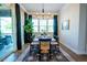 Inviting dining room with ample natural light and a stylish light fixture at 134 Cotten Dr, Morrisville, NC 27560