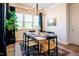 Elegant dining room featuring a modern chandelier and large windows at 134 Cotten Dr, Morrisville, NC 27560