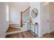 Stylish entryway showcases a modern console table, round mirror, and wood staircase at 134 Cotten Dr, Morrisville, NC 27560
