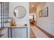 Elegant entryway with hardwood floors, stairs, and a view into the living room at 134 Cotten Dr, Morrisville, NC 27560