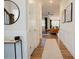 Hallway featuring hardwood floors and opening to living area at 134 Cotten Dr, Morrisville, NC 27560