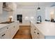 Gourmet kitchen featuring granite countertops, stainless steel appliances, and modern fixtures at 134 Cotten Dr, Morrisville, NC 27560