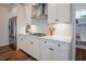 Bright kitchen showcases white cabinetry, stainless steel appliances, and a convenient layout at 134 Cotten Dr, Morrisville, NC 27560