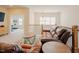 Comfortable living room featuring leather couches, neutral tones, and great natural lighting at 134 Cotten Dr, Morrisville, NC 27560