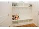 Functional mudroom features a built-in bench with hooks and shelving for organized storage at 134 Cotten Dr, Morrisville, NC 27560