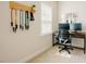 Dedicated office space with natural light features desk, dual monitors, and workout bands at 134 Cotten Dr, Morrisville, NC 27560