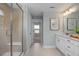 Stylish bathroom with a glass shower enclosure, bright lighting, and a sleek white vanity at 1412 Main St, Lillington, NC 27546