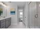 Bathroom features a glass shower, single sink vanity, and neutral finishes at 1412 Main St, Lillington, NC 27546