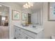 Bright bathroom featuring double sinks, a large mirror, and stylish decor for a modern and functional space at 1412 Main St, Lillington, NC 27546