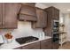 Close up of a gourmet kitchen featuring stainless steel appliances, sleek countertops, and custom cabinetry at 1412 Main St, Lillington, NC 27546