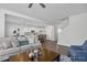 Open concept living room with hardwood floors, neutral paint, and ample seating at 1412 Main St, Lillington, NC 27546