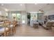 Bright, open-concept living space with modern furnishings, wood floors, and an abundance of natural light at 1412 Main St, Lillington, NC 27546
