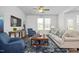 Spacious living room with neutral colors, stylish furniture, and ample natural light at 1412 Main St, Lillington, NC 27546