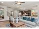 Inviting living room flows into the kitchen, featuring an open layout, neutral decor, and hardwood floors at 1412 Main St, Lillington, NC 27546