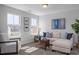 Bright living room with large windows, comfortable seating, and stylish decor at 1412 Main St, Lillington, NC 27546