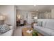Versatile loft area features a cozy seating area, a built-in desk, and soft natural light at 1412 Main St, Lillington, NC 27546