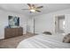 Comfortable main bedroom with neutral decor and a view of the ensuite bathroom at 1412 Main St, Lillington, NC 27546