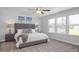 Spacious main bedroom boasts natural light from three windows and neutral decor at 1412 Main St, Lillington, NC 27546