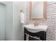 Stylish powder room features patterned wallpaper, modern vanity, and brushed gold fixtures at 1427 Van Page Blvd, Raleigh, NC 27607