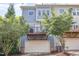 Charming two-story house with a garage and private balcony, framed by greenery for enhanced privacy at 1427 Van Page Blvd, Raleigh, NC 27607