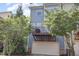 Two-story home featuring a garage and a private balcony, enhanced by lush trees at 1427 Van Page Blvd, Raleigh, NC 27607