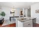 Open kitchen design with granite countertops, stainless steel appliances, and a dining area at 1427 Van Page Blvd, Raleigh, NC 27607