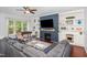 Cozy living room featuring built-in shelving, a fireplace, and comfortable seating at 1427 Van Page Blvd, Raleigh, NC 27607