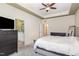 Spacious main bedroom with a ceiling fan and an ensuite bathroom at 1427 Van Page Blvd, Raleigh, NC 27607