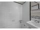 The bathroom features black and white tile and a shower at 1512 Oxford Rd, Henderson, NC 27536