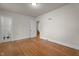 Bedroom with hardwood floors has access to hall and bathroom at 1512 Oxford Rd, Henderson, NC 27536