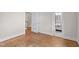 View of bedroom leading to bathroom featuring classic black and white tiled floor at 1512 Oxford Rd, Henderson, NC 27536