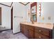 Well-lit bathroom featuring vanity with ample storage, and a vintage mirror for a clean and classic aesthetic at 1608 New Hill Olive Chapel Rd, Apex, NC 27502