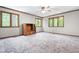 Bright bedroom with natural light, neutral walls, and plush carpet creating a serene and inviting space at 1608 New Hill Olive Chapel Rd, Apex, NC 27502