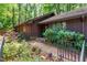 Inviting front entrance with brick pathway, lush landscaping, and charming wrought iron fencing at 1608 New Hill Olive Chapel Rd, Apex, NC 27502
