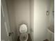 Neat and clean half-bathroom featuring a standard toilet, a pedestal sink and essential accessories, ready for personalization at 162 Tuskeegee Dr, Smithfield, NC 27577