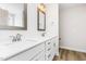 Modern bathroom with dual sinks, quartz countertops, framed mirrors and contemporary fixtures at 162 Tuskeegee Dr, Smithfield, NC 27577