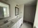 Bathroom with dual sinks and framed mirrors at 162 Tuskeegee Dr, Smithfield, NC 27577