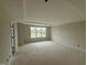 Spacious bedroom with large window and ample natural light, awaiting final touches at 162 Tuskeegee Dr, Smithfield, NC 27577