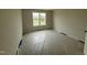 Spacious bedroom featuring natural light and neutral walls, covered floor, offering a blank canvas for customization at 162 Tuskeegee Dr, Smithfield, NC 27577