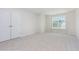 Bright bedroom features a large window offering natural light and a spacious closet at 162 Tuskeegee Dr, Smithfield, NC 27577