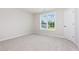 Well-lit bedroom showcasing a large window and closet, creating a comfortable living space at 162 Tuskeegee Dr, Smithfield, NC 27577